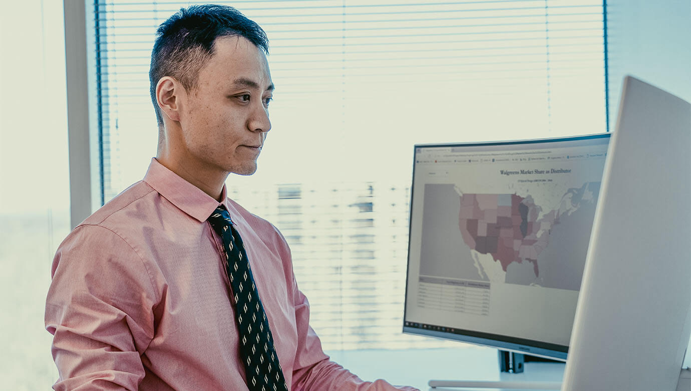 A thumbnail showcasing a Potomac Analytics employee working on a visualization in an office.